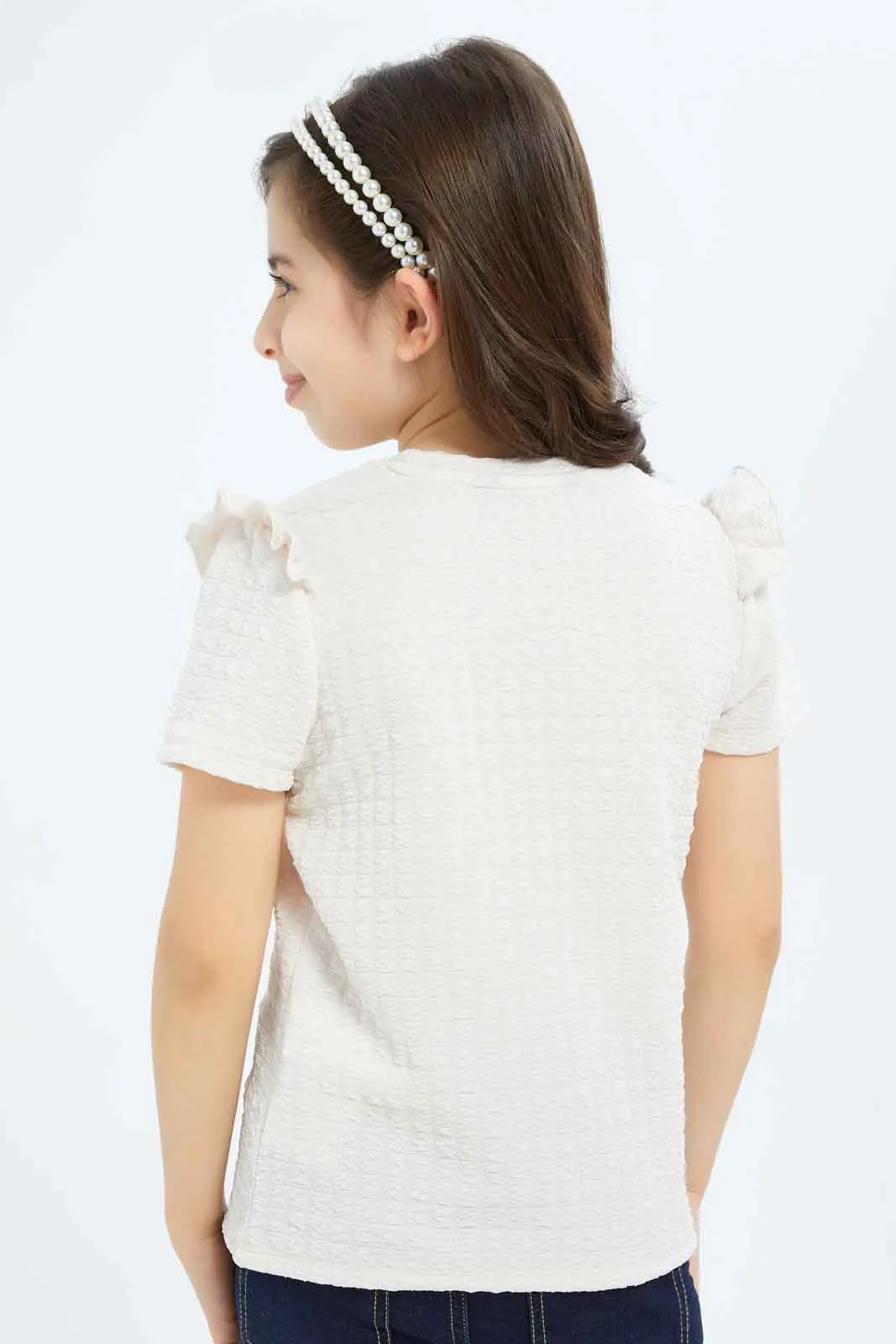 Girls Peach Textured Top With Attached Ribbon On Chest
