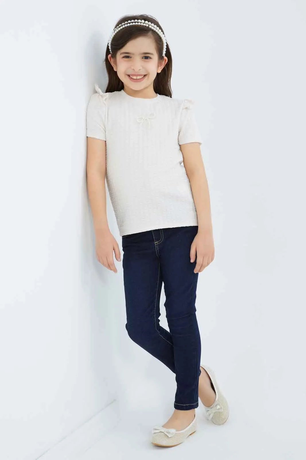 Girls Peach Textured Top With Attached Ribbon On Chest